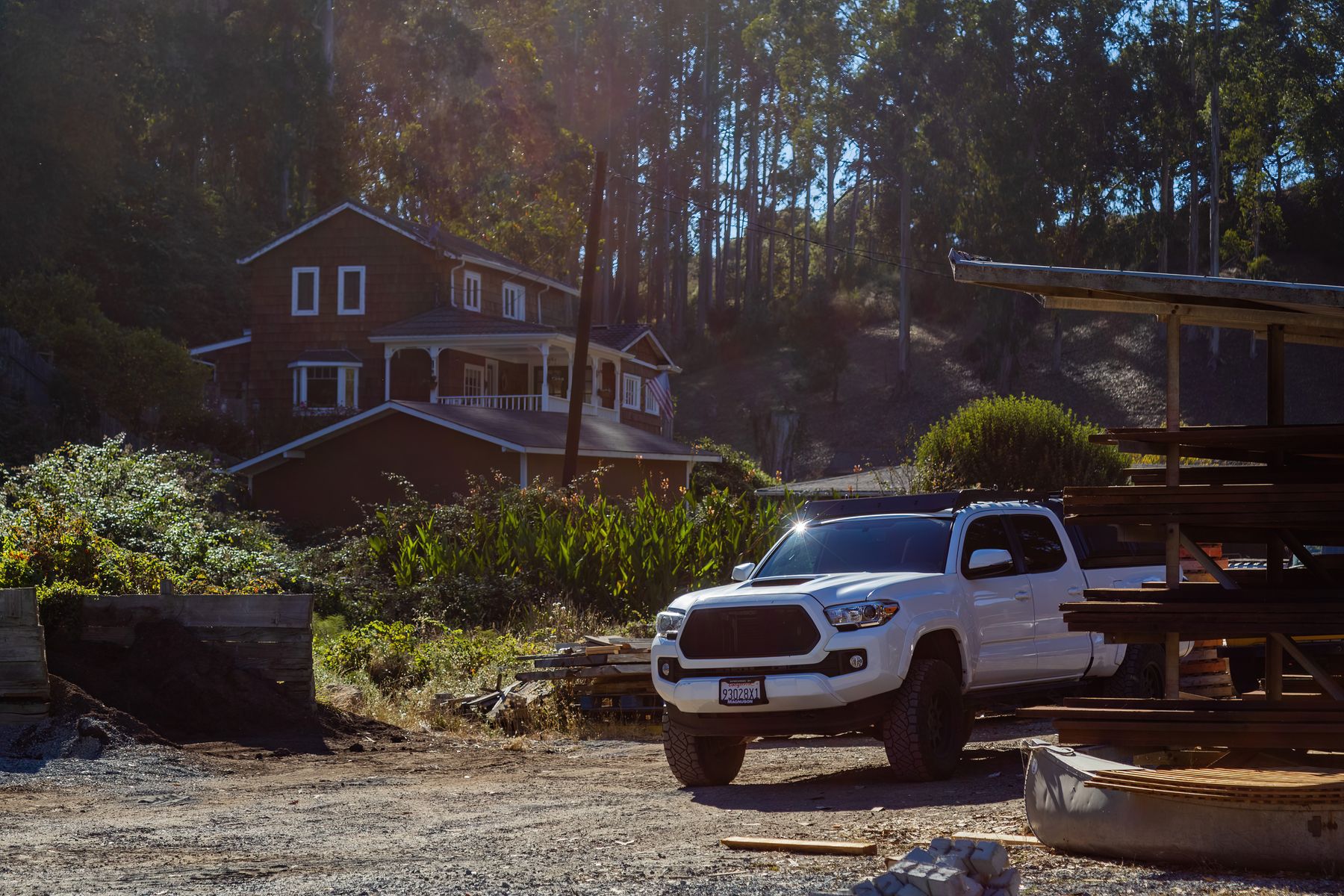 Work truck parked at a wooded residential property